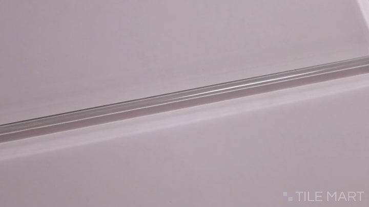 Video of Glass Pastel Pink 3x12 Glossy. A delicate pastel pink glass tile with a polished glossy finish, adding a touch of warmth and elegance with a contemporary appeal.