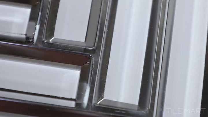 Video featuring Modern Glass White Herringbone Glossy Mosaic. A bright white glass tile with a high-gloss sheen, designed in an elegant herringbone pattern for a crisp, contemporary look.