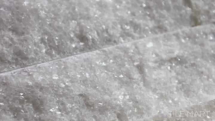 Video showcasing Rockmount Carrara 6X24 Stacked Stone Panel Splitface Marble. A stunning natural stone panel with soft white tones, perfect for accent walls and fireplaces.