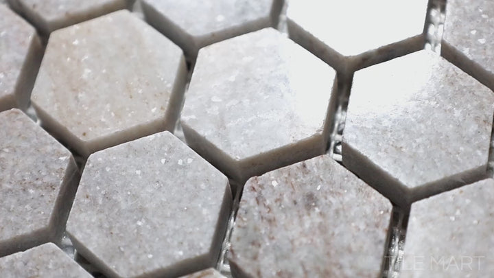 Video showcasing Sto-Re Ocean White 1-1/8" Hexagon Polished Marble Mosaic. A sleek Ocean White marble mosaic with a polished surface, designed in a hexagonal layout to enhance any space.