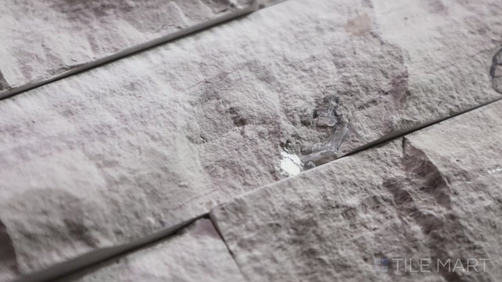 Video featuring Rockmount Gray Oak 6X24 Stacked Stone Panel Splitface Marble. A textured marble stacked stone panel in gray hues, perfect for rustic or contemporary spaces.