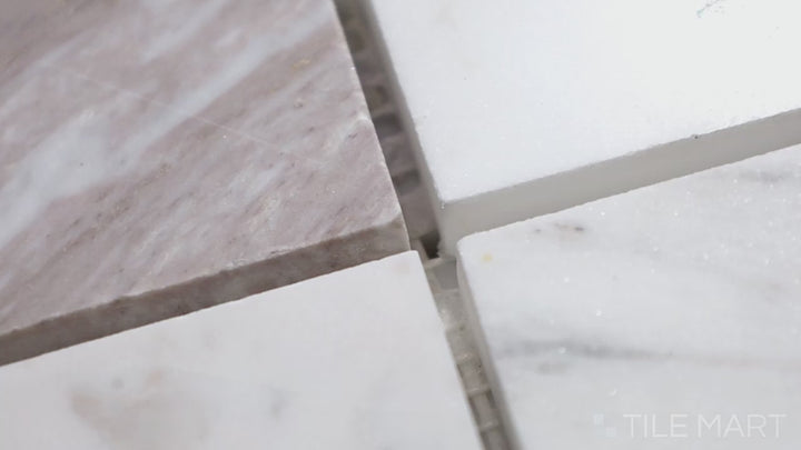 Video highlighting Sto-Re Volakas 2.25" Square Polished Marble Mosaic. Luxurious Volakas marble mosaic with a polished surface, featuring large square tiles for a striking appearance.