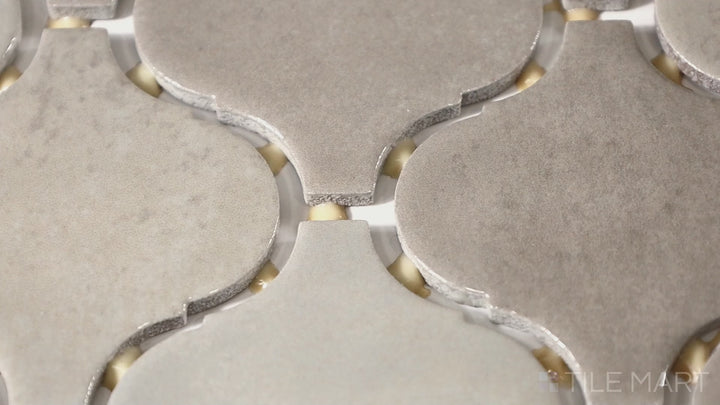 Video of Mesmerist Trance Arabesque Glossy Glazed Ceramic Mosaic. A high-gloss arabesque tile that enhances depth and elegance in any design.