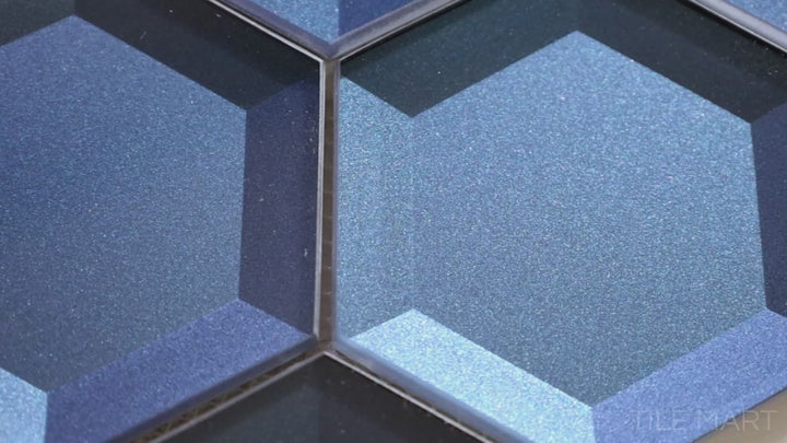 Video showcasing Bold Glass Blue 3-inch Hexagon Glossy Mosaic. Featuring a vibrant blue hue and a sleek glossy finish, this glass mosaic tile creates a bold, modern look with a striking hexagonal design.