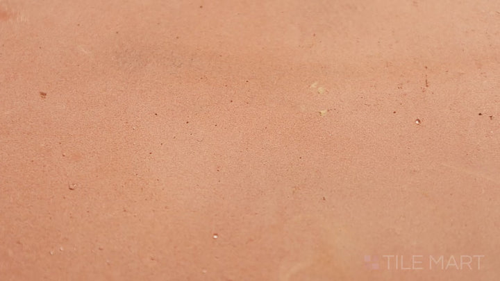 Video highlighting Saltillo Salmon 16x16 Natural Terracotta. A large-format terracotta tile in a warm salmon hue, creating a timeless and earthy aesthetic.