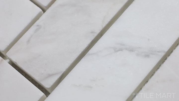 Video showcasing Sto-Re Volakas Herringbone Polished Marble Mosaic. A refined Volakas marble mosaic with a polished herringbone pattern, ideal for stylish interiors.