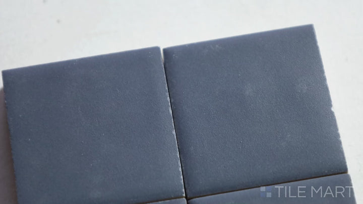 Video featuring Kasbah Taco Blue Night 1X1 Matte Porcelain Tile. A deep navy-blue mini tile, adding richness and depth to backsplashes and accent walls.
