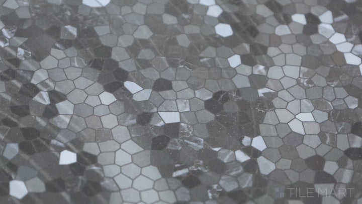 Video featuring Tele Di Marmo Revolution Calacatta Black 24X48 Polished Porcelain. A bold, polished porcelain tile mimicking black marble with crisp, striking white veining.