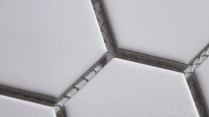 Video featuring Porcelain Glazed Mosaics White 2-inch Hexagon Matte. A bright white matte porcelain hexagonal mosaic, offering a classic and versatile look.