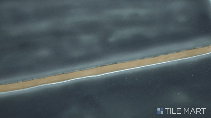 Video of Marin Black Sea 2.5X10 Gloss Glazed Ceramic. A striking black glossy tile in an elongated format, perfect for bold accent walls.