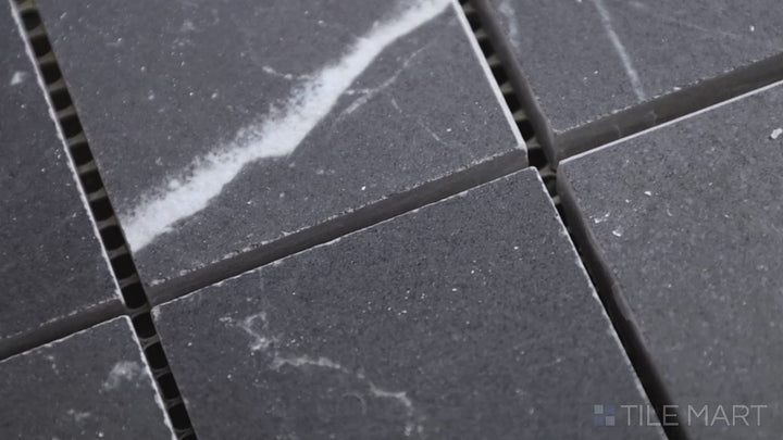 Video featuring Tele Di Marmo Revolution Calacatta Black 2" Square Matte Porcelain Mosaic. A luxurious black marble-inspired mosaic with bold white veining for dramatic design effects.