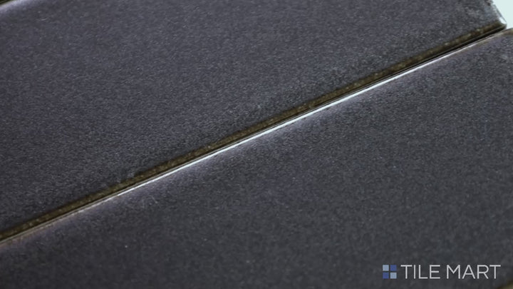 Video highlighting Zenia Gravity 2.5X9 Matte Glazed Porcelain. A modern gray matte tile that enhances depth and texture in contemporary design spaces.