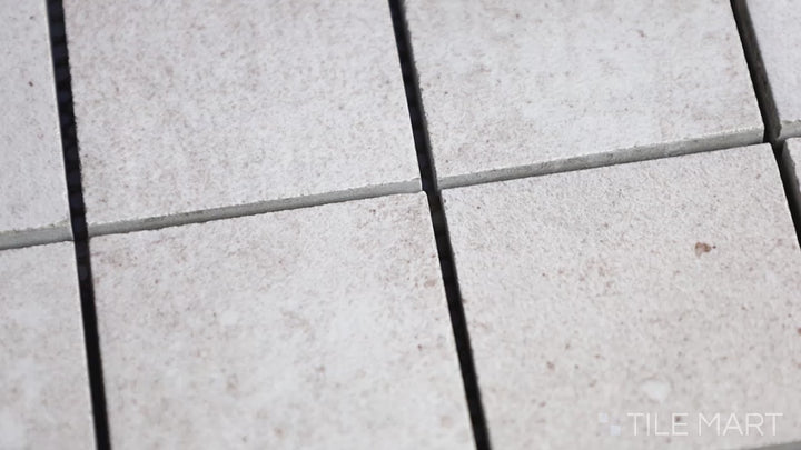 Video featuring Ecocrete Melted Ice 2-inch Square Matte Porcelain Mosaic. A light-toned matte porcelain mosaic, adding a cool and elegant touch with a soft finish.