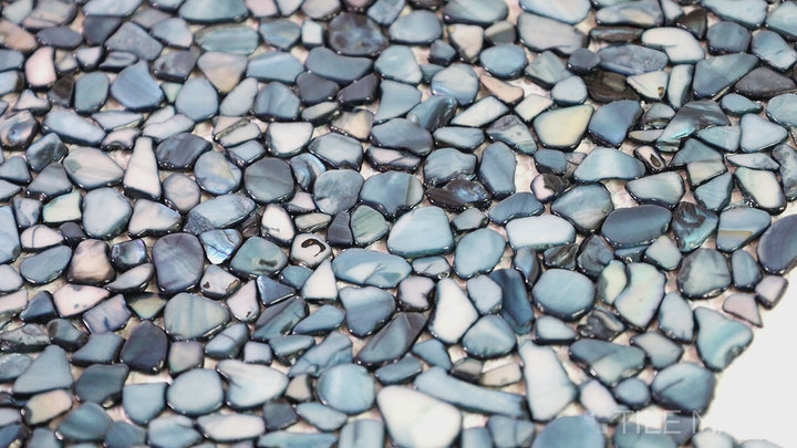 Video showcasing D-Lux Pearl Celestial Pearl Pebble Glossy Shell Marble Mosaic. A unique pearl-inspired mosaic with glossy shell and marble elements, adding a celestial glow to interiors.