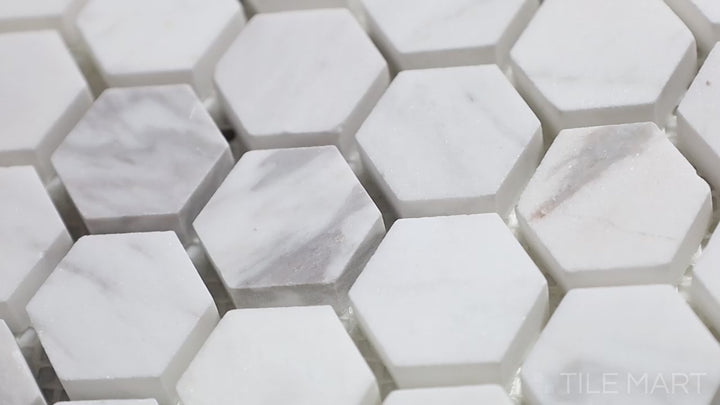 Video highlighting Sto-Re Volakas 1-1/8" Hexagon Polished Marble Mosaic. Elegant Volakas marble with a polished finish, crafted in a hexagonal shape to add depth and luxury.