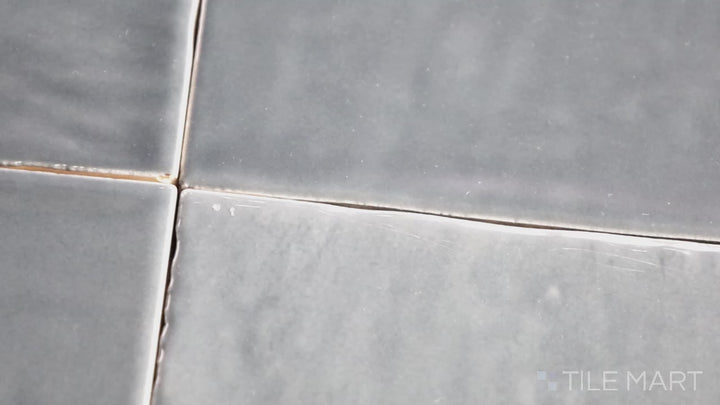 Video highlighting Marin Midnight Tide 4X4 Gloss Glazed Ceramic. A deep ocean-blue glossy tile that reflects light beautifully, enhancing any interior space.