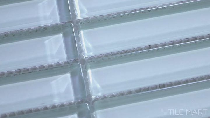 Video highlighting Glass Pastel Blue Grid Glossy Mosaic. A soothing pastel blue glass mosaic with a high-gloss finish, arranged in a structured grid pattern for a sleek, uniform look.