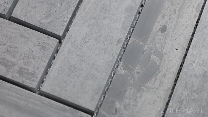 Video featuring Sto-Re Wooden Blue Herringbone Polished Marble Mosaic. A contemporary Wooden Blue marble mosaic with a polished herringbone design.