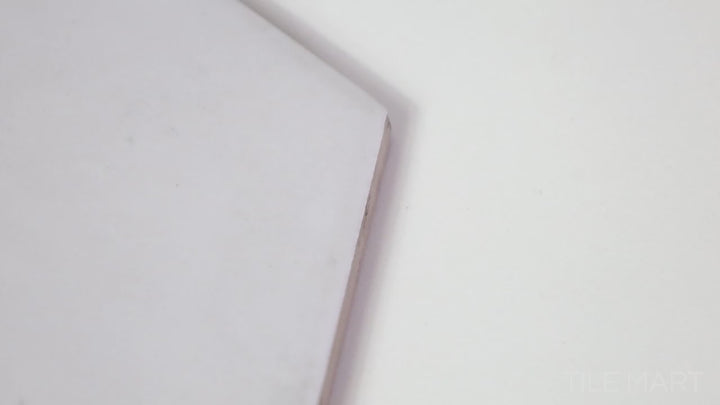 Video showcasing Hexatile Blanco 8-inch Hexagon Matte Porcelain. A crisp white hexagonal porcelain tile with a smooth matte finish, offering a clean and geometric aesthetic.