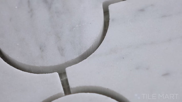 Video featuring Sto-Re Carrara Arabesque Polished Marble Mosaic. A polished Carrara marble mosaic with an arabesque pattern, adding timeless elegance and fluid design.