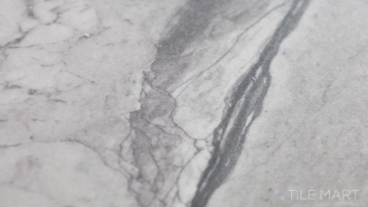 Video of Kaya Onda Gray 12X24 Polished Porcelain. A sleek, polished gray porcelain tile with a gentle wave pattern for a stylish and refined aesthetic.