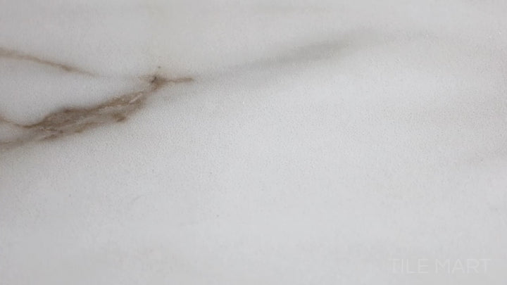 Video featuring Supreme Evo Antique White 24X48 Polished Porcelain. A luxurious white marble-look porcelain tile with a polished finish, exuding timeless elegance.