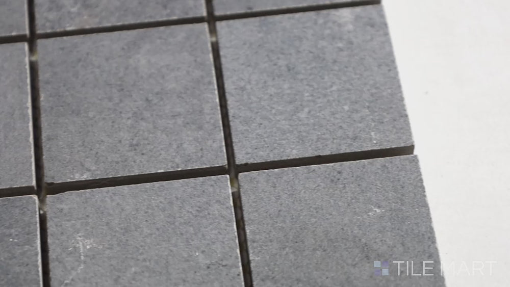 Video featuring Concrete Graphite 2-inch Square Matte Porcelain Mosaic. A bold graphite porcelain mosaic with a matte texture, providing a modern and structured appearance.