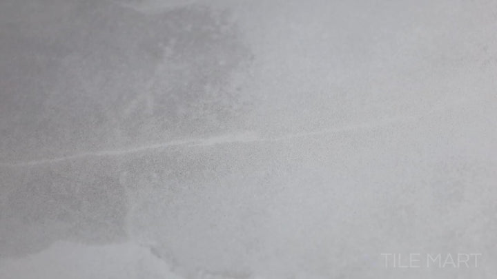 Video of Onyx White 48x48 Polished Porcelain. A large-format white polished porcelain tile with subtle veining, delivering a clean and timeless marble-inspired aesthetic.