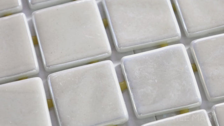 Video of Opalo Blanco 1-inch Square Glossy Glass Mosaic. A bright white glossy glass mosaic with a smooth finish, offering a timeless and clean aesthetic.