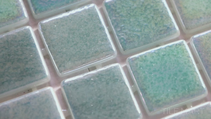 Video highlighting Opalescent Verde 1-inch Square Glossy Glass Mosaic. A vibrant green opalescent glass mosaic with a glossy surface, bringing a natural and radiant feel.