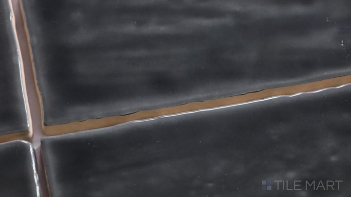 Video showcasing Marin Black Sea 4X4 Gloss Glazed Ceramic. A rich black glossy tile with a bold presence, creating depth and drama in modern interiors.