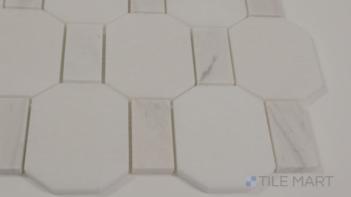 Video of The Finish Line Pale Beige Hexagon Polished Marble Mosaic. A light beige hexagonal marble tile with a polished sheen, perfect for timeless and versatile interior designs.