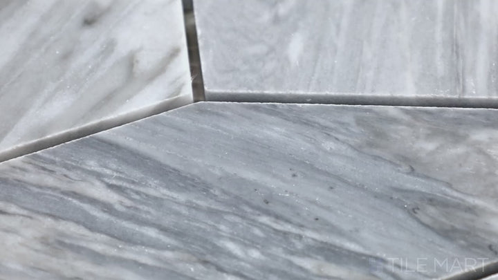 Video highlighting Sto-Re Bardiglio Elongated Hexagon Polished Marble Mosaic. A stunning Bardiglio marble mosaic with an elongated hexagon pattern, offering a sleek aesthetic.