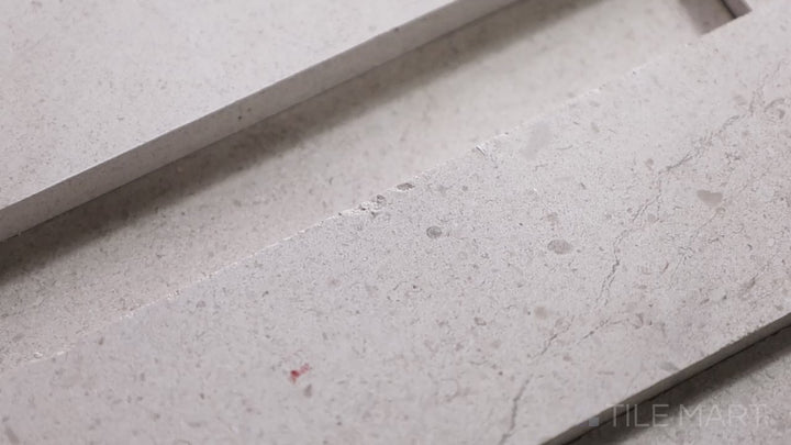 Video of Modern Ledgestone Cream 6x24 Porcelain. A soft cream-toned ledgestone porcelain tile with a textured surface, adding warmth and elegance.