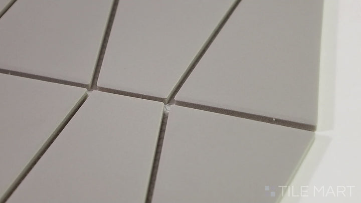 Video featuring Marin Pebble Gray Trapezoid Matte Glazed Porcelain Mosaic. A versatile gray trapezoid tile with a smooth matte finish, ideal for modern and industrial spaces.
