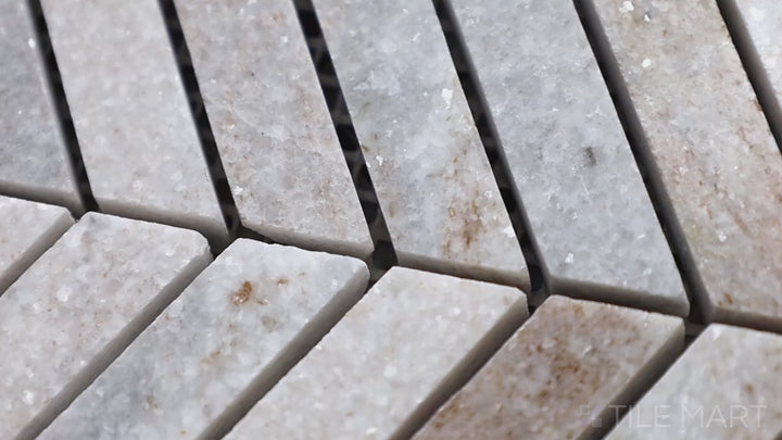 Video featuring Sto-Re Ocean White Chevron Polished Marble Mosaic. A bright and polished Ocean White marble mosaic with a chevron design, adding modern sophistication.