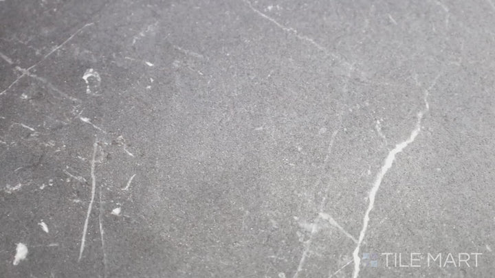 Video featuring Tele Di Marmo Revolution Calacatta Black 24X48 Matte Porcelain. A dramatic black marble-look tile with striking white veining, ideal for sophisticated interiors.