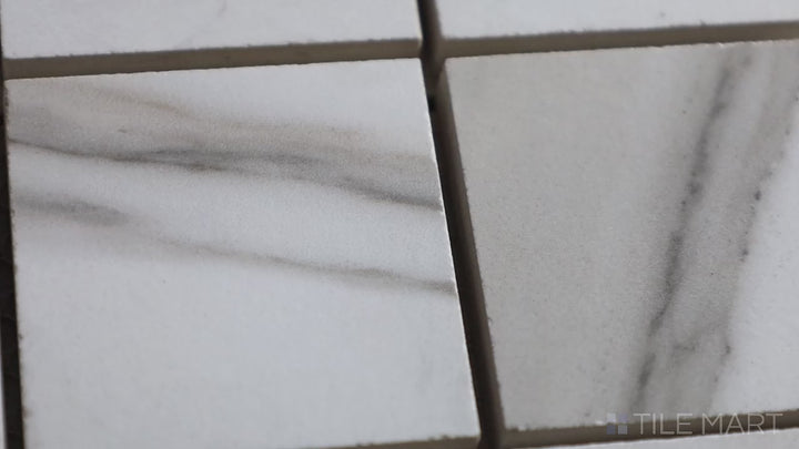 Video featuring Tele Di Marmo Reloaded Calacatta 2" Square Matte Porcelain Mosaic. A small-format white marble-effect tile with a matte finish, ideal for refined accents.