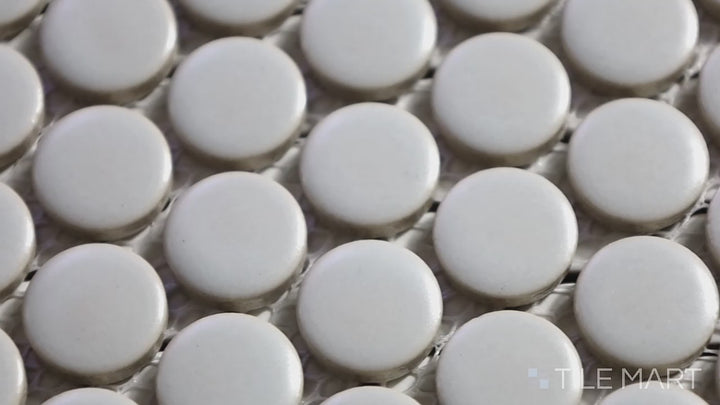 Video showcasing Pure Grey Penny Round Matte Porcelain Mosaic. A neutral gray matte porcelain penny round mosaic, adding subtle texture and contemporary charm.