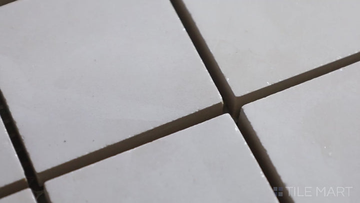 Video of Tele Di Marmo Revolution Thassos 2" Square Polished Porcelain Mosaic. A luminous white marble-effect mosaic with a reflective polished surface for added sophistication.