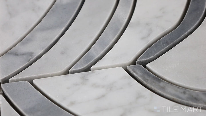 Video highlighting Lavaliere Carrara White/Bardiglio Melody Polished Carrara, Bardiglio Mosaic. A stunning mix of Carrara white and Bardiglio gray, creating a harmonious and elegant mosaic design.