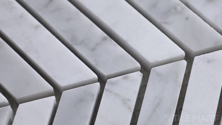 Video showcasing Sto-Re Carrara Chevron Polished Marble Mosaic. A refined Carrara marble mosaic featuring a chevron pattern, polished for an elegant finish.