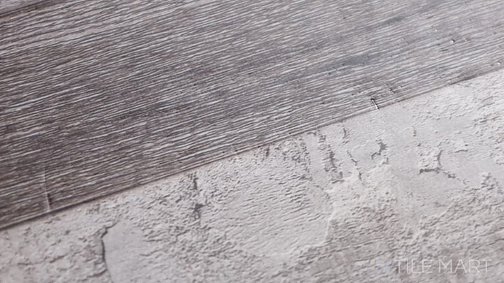 Video highlighting Cyrus Mezcla 7X48 Low Gloss Luxury Plank Vinyl. A sophisticated blend of gray and brown tones with a natural wood grain finish for timeless appeal.
