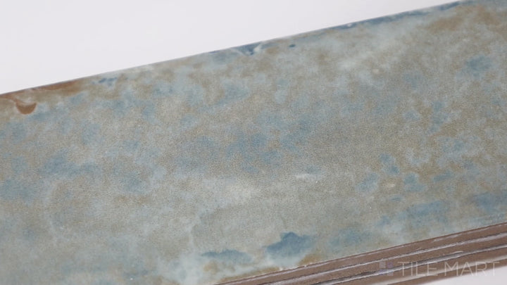 Video highlighting Organic Clay Mercury 2X10 Matte Ceramic. A muted gray tile with a matte surface, bringing depth and sophistication to any space.