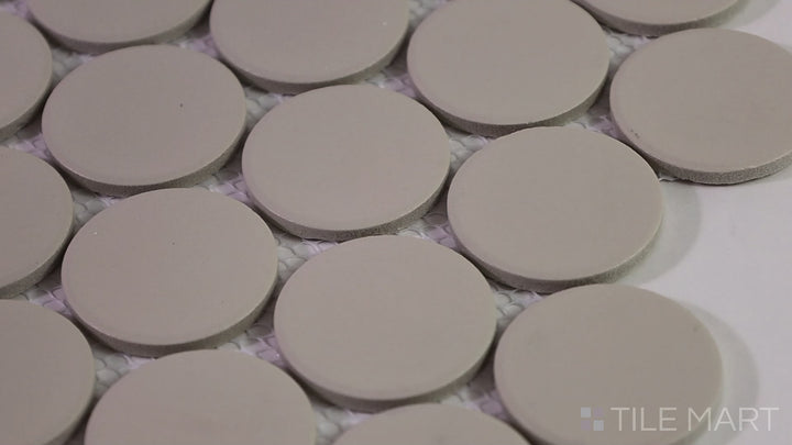 Video highlighting Marin Sand Dollar 2" Penny Round Matte Glazed Porcelain Mosaic. A warm beige penny round tile that adds a natural, earthy feel to any space.