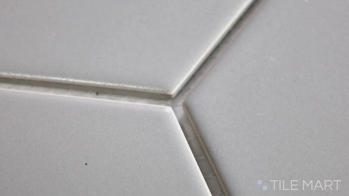 Video of Porcelain Glazed Mosaics Gray 4-inch Hexagon Matte. A sleek gray matte porcelain hexagonal mosaic with a subtle texture, perfect for a modern aesthetic.