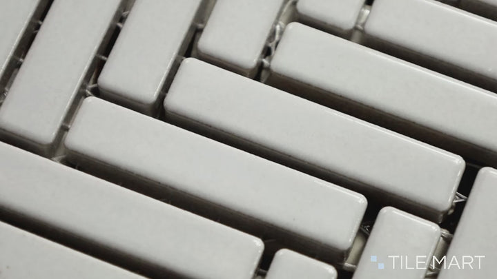 Video highlighting 90° Off White Herringbone Gloss Glazed Porcelain Mosaic. A soft off-white glossy herringbone tile, ideal for bright and airy interiors.