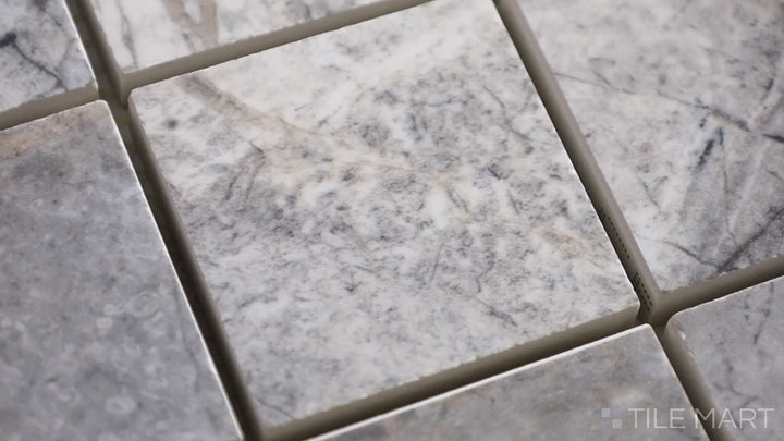 Video highlighting Exotic Stone Cosmopolitan Mystic Grey 2-inch Square Polished Porcelain Mosaic. A sleek grey porcelain mosaic with a glossy polished finish, blending modern sophistication with natural stone texture.