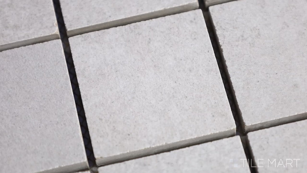 Video highlighting Concrete Gray 2-inch Square Matte Porcelain Mosaic. A neutral gray porcelain mosaic with a smooth matte finish, offering a sleek and minimalistic appeal.