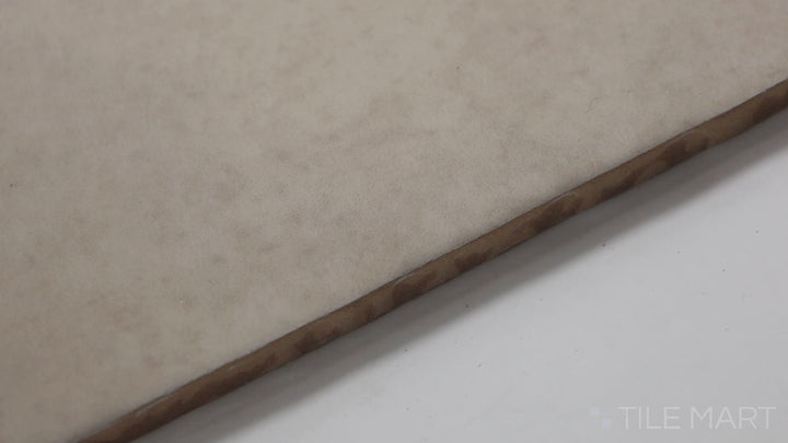 Video featuring Highland Lake Almond 3X10 Glossy Ceramic. A warm beige tile with a sleek glossy finish, ideal for adding natural warmth to kitchen and bathroom spaces.